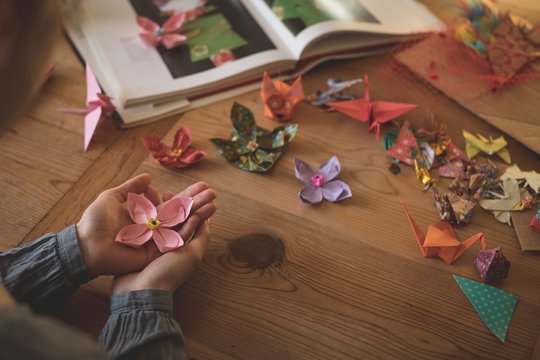 Close Up Of Woman Hand Holding Origami