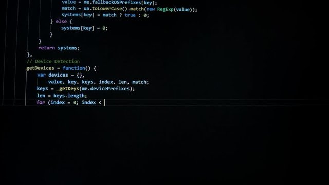 A programmer writes a code, close up.