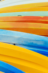 Pile of colorful canoes on the beach of Deauville. Close up. Abstract background and texture