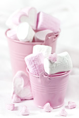 White and pink marsmallow in buckets