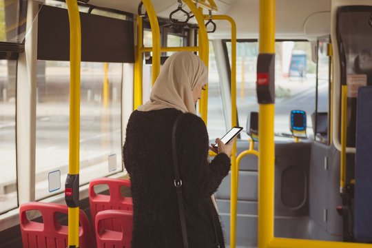 Urban Hijab Woman Using Mobile Phone In The Bus