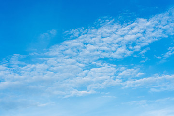 Naklejka na ściany i meble Beautiful blue sky with clouds. The texture of the sky. Background
