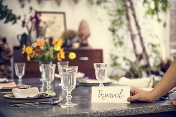Restaurant table setting service with reserved card