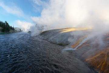 Hot water flows into Firehole River, Yellowstone National Park