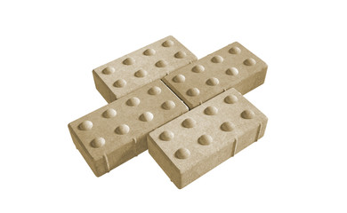3D realistic render of three yellow lock paving bricks. Isolated on white background.