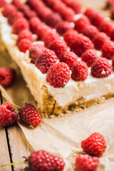 Fresh raspberry cheesecake on the rustic background. Selective focus. Shallow depth of field.