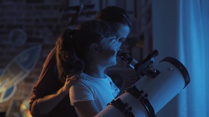 Happy sisters watching stars with a telescope - Powered by Adobe