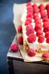 Fresh raspberry cheesecake on the rustic background. Selective focus. Shallow depth of field.