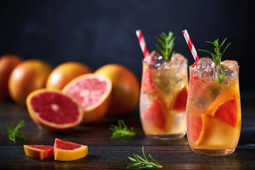 Refreshing cocktail with ice grapefruit and rosemary.