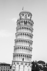 Leaning Tower of Pisa o Cathedral square in Pisa, Tuscany, Italy. Black and white image.