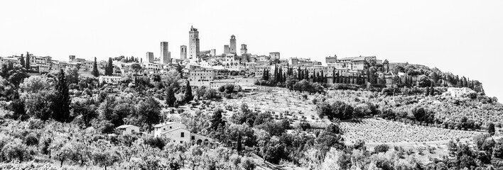 San Gimignano - medieval town with many stone towers, Tuscany, Italy. Panoramic view of cityscape. Black and white image.