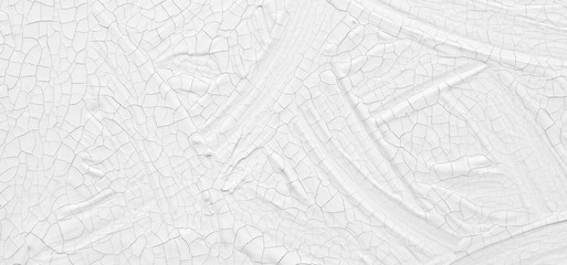 The texture of the paint is white. The background is drawn with a brush with a divorce on the wall.