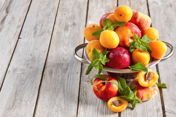 Apricots, nectarines and saturn peaches background © karaidel