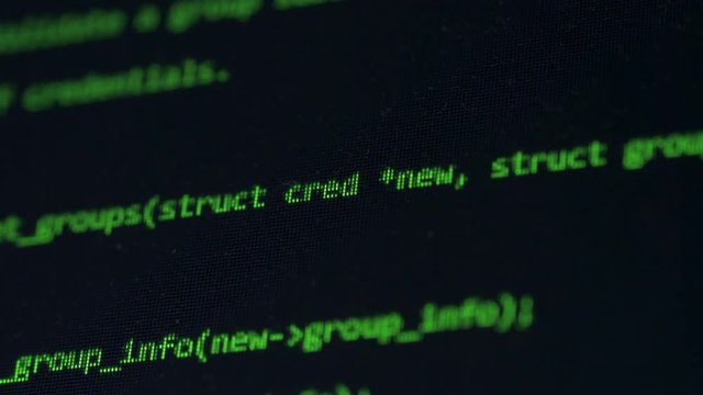 Hacking code written on a screen, close up.