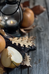 Asian pears, lantern and fall leaves background