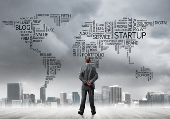 Motivation and inspiration concept with modern cityscape and businessman observing it