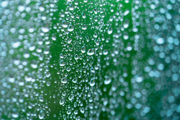 droplets on a window on a green background