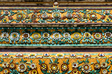 Close up beauitful mosaic tiles of large stupas in Wat Pho or Wat Phra Chetuphon Vimolmangklararm Rajwaramahaviharn is one of Bangkok's oldest temples, THAILAND