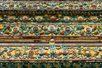 Close up beauitful mosaic tiles of large stupas in Wat Pho or Wat Phra Chetuphon Vimolmangklararm Rajwaramahaviharn is one of Bangkok's oldest temples, THAILAND
