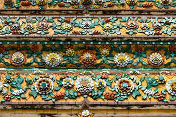 Close up beauitful mosaic tiles of large stupas in Wat Pho or Wat Phra Chetuphon Vimolmangklararm Rajwaramahaviharn is one of Bangkok's oldest temples, THAILAND