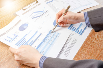 business man analyzing graph and chart document report