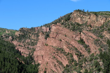 Layered rock cliff to the sky