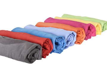 Row of rolled t-shirts with multi colored