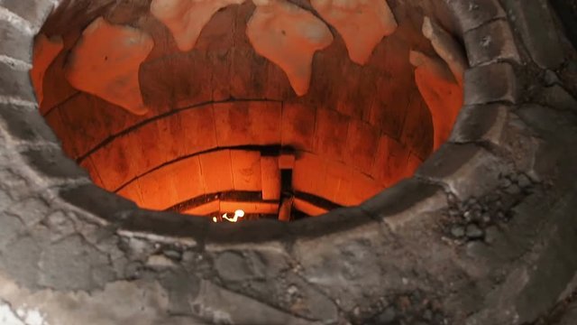 Traditional Bakery Tone or Torne or Turne for Baking a Georgian Shotis Puri or Shoti Bread. Cooking Process: Baker Shapes the Flat Bread and Sticking Dough to Wall of Oven and Taking Ready Shoti in