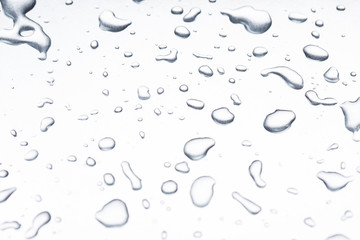 Drops of water on a gray background closeup