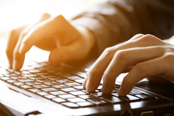 hand using mobile laptop computer
