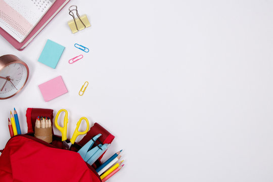 Stationeries and office supplies on white background. Flat lay. Top view with copy space. Back to school concept.