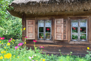 Old wooden house with widnow shutters