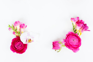 Flowers composition frame made of fresh orchid and ranunculus on white background. Flat lay, top view, copy space