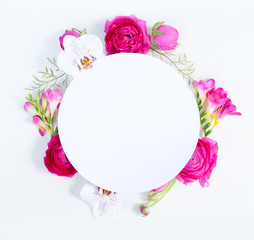 Fototapeta na wymiar Flowers composition. Round frame made of dried eucaliptus leaves and flowers on white background. Flat lay, top view, copy space on white paper