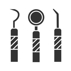 Dental instruments glyph icon