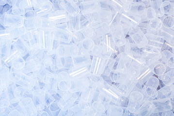 Lot of white plastic transparent caps