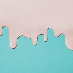 pink paint texture on blue canvas. Minimalistic background with copy space. Creative concept.