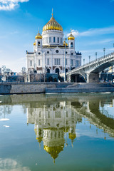  Cathedral of Christ the Savior with bridge over the Moscova river and blue sky, Moscow, Russia