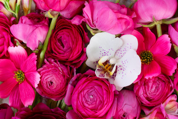 Flowers composition. Floral natural background made of rununculus and orchid flowers flowers.