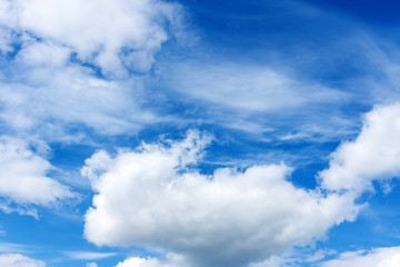 beautiful white clouds on the background of bright blue sky.