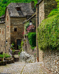 Sunny road in the medieval village of Belcastel, France