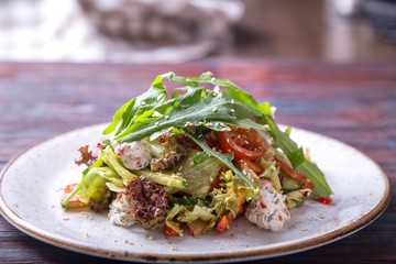 Arugula with cottage chees, cherry and pesto sauce.
