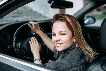 Fototapeta na wymiar beautiful young girl driver smiling. 