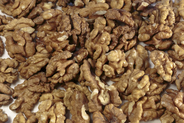 Walnut kernels as concept of vegan food. On white background.
