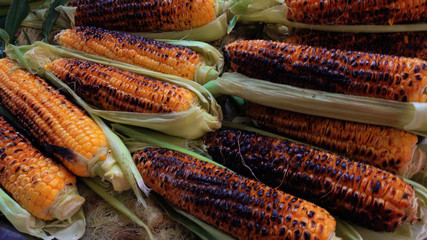 Fried and boiled corn. A seller of fast food at a flea market in Turkey. The concept of eating and...