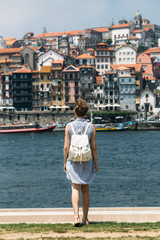 Fototapeta na wymiar Woman traveling in Porto city