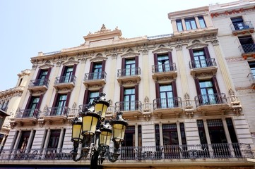 Fototapeta na wymiar Lantern in front of the facade of one of the beautiful houses on La Rambla in Barcelona