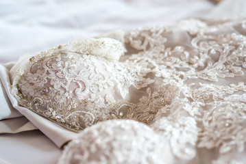 Wedding dress close up - white lace with floral pattern