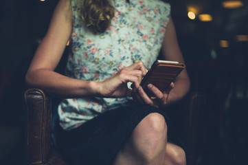 Young woman using her smartphone in cafe