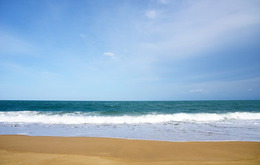 Sea wave White and blue ocean with sandy beach Background in Summer holidays Time of Happiness